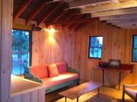 Living room with wood paneled walls