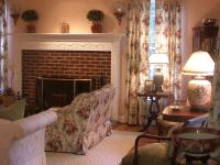 Living room with brick fireplace